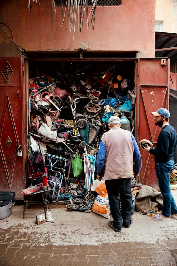 Image of hoarded clutter with two people